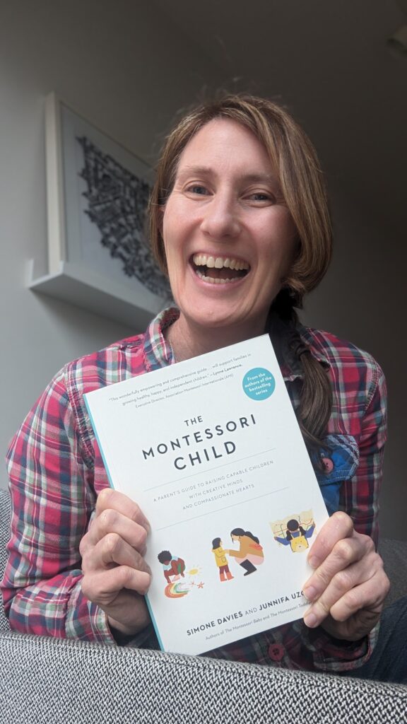 Simone holding The Montessori Child book